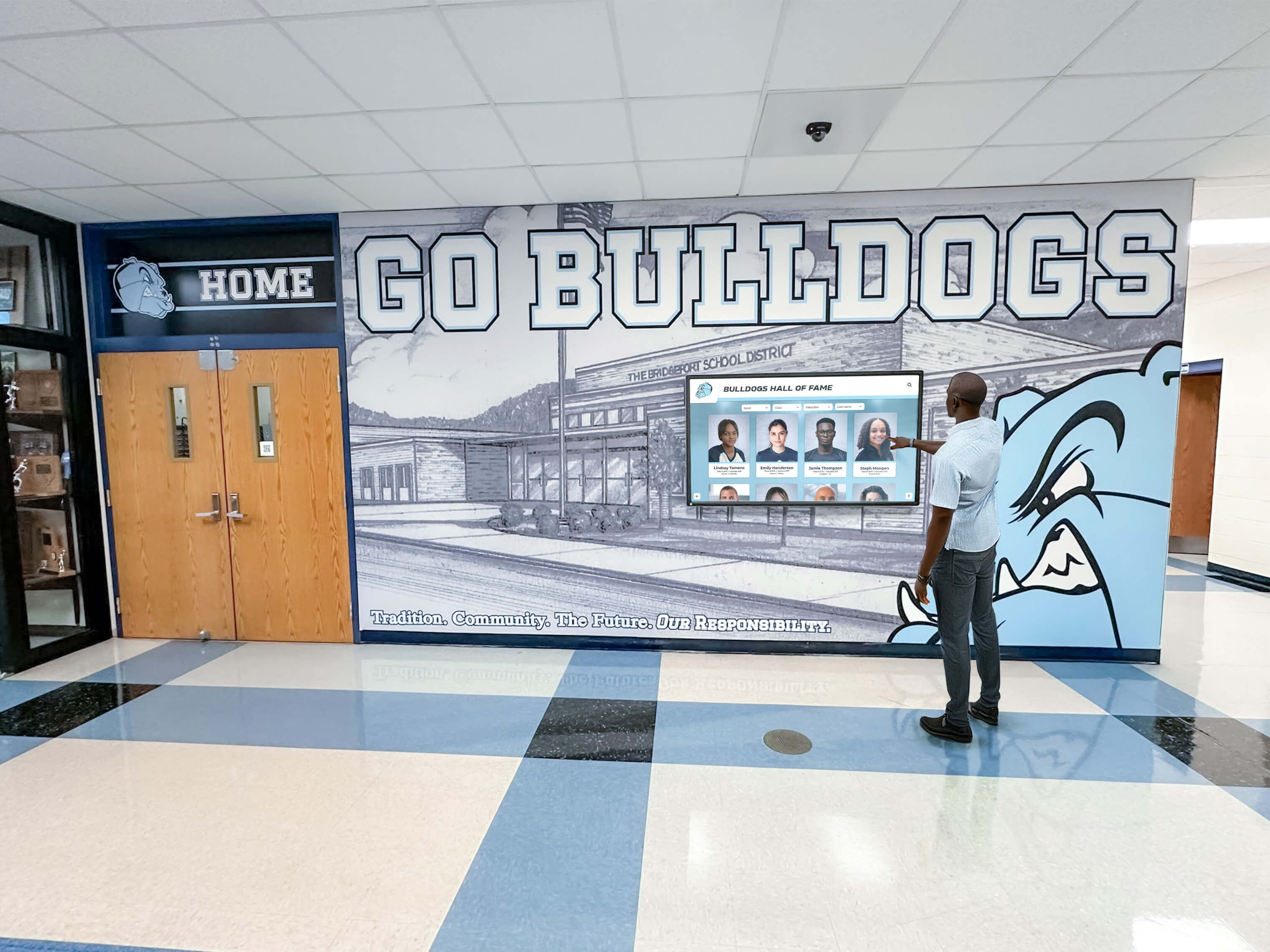 Person using All-State recognition touchscreen in school hallway