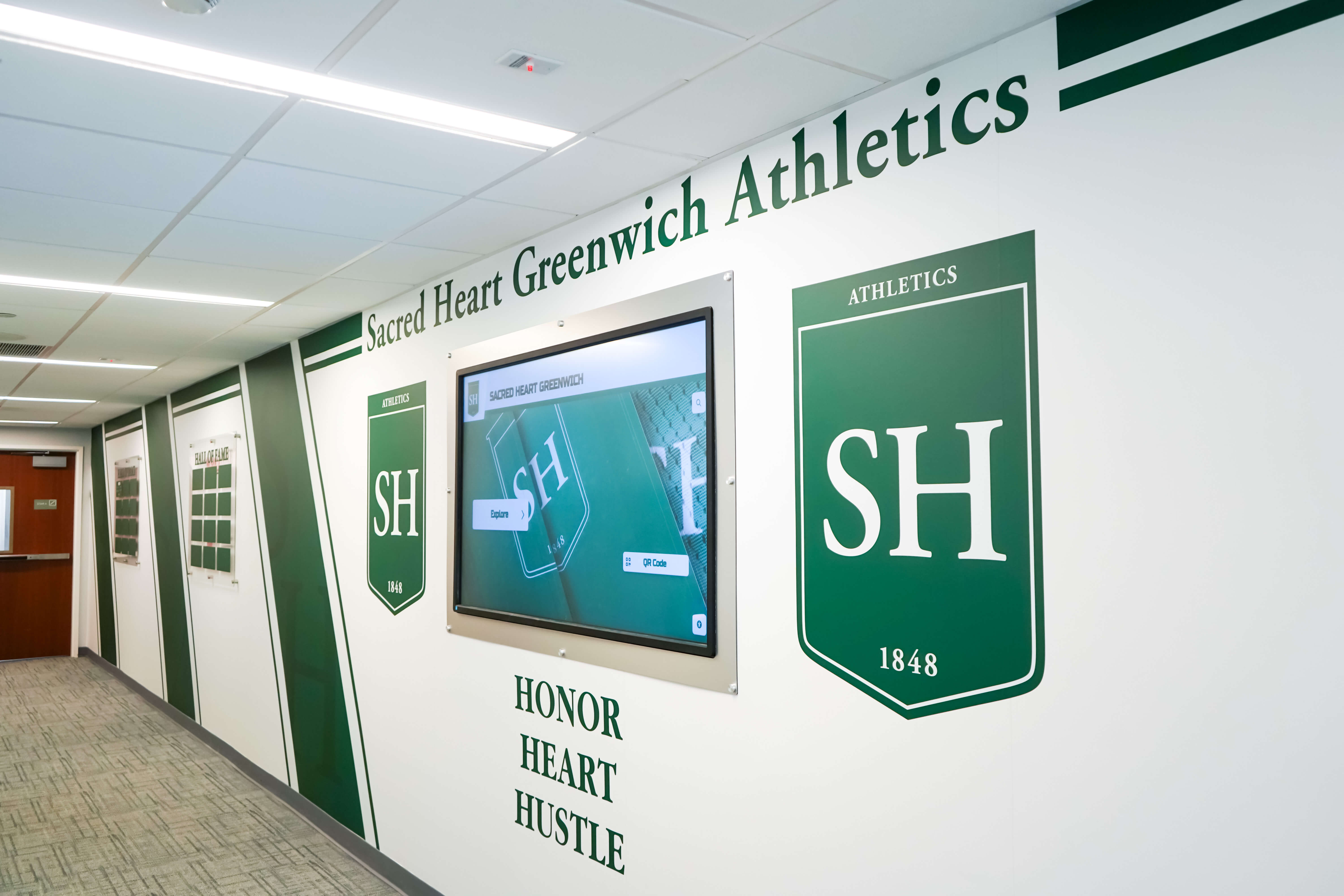Athletics hallway recognition shield display