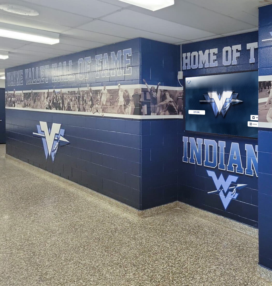 School athletic hallway wall of fame mural with recognition displays for college-bound athletes